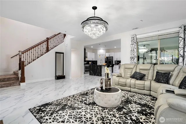 a living room with furniture a rug and a view