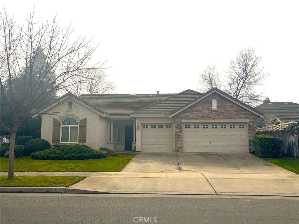 3533 San Isidro Avenue Merced, CA 95348 - Photo 3 of 3 a view of a house with a yard plants and large tree