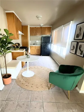 a living room with furniture and a lamp