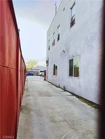 a building with car parked in front of it