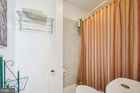 a bathroom with a shower curtain