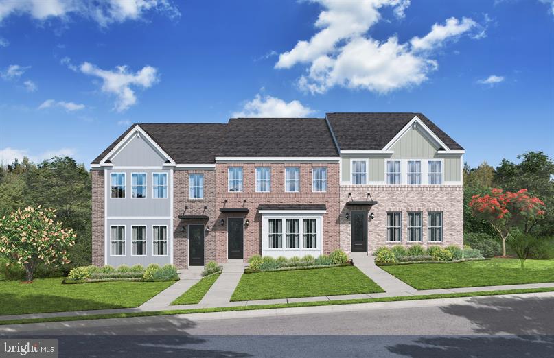 a view of residential houses with yard and green space