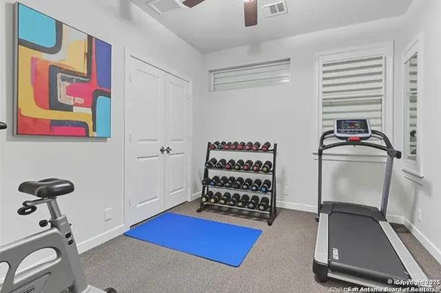 a room with gym equipment and a window