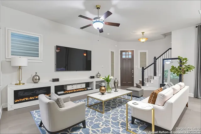 a living room with furniture and a flat screen tv