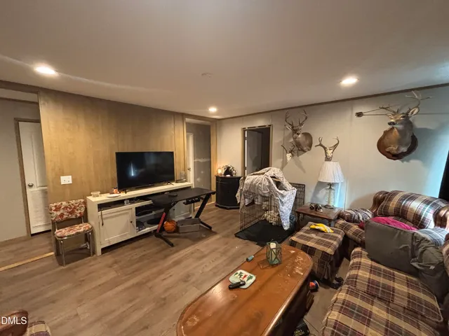 a bedroom with furniture and a gym equipment