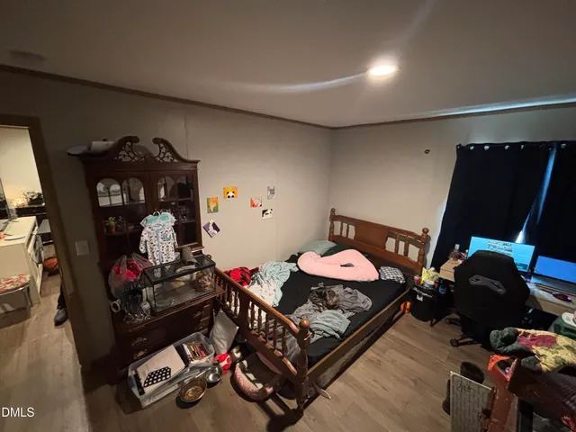 a bed room with two bed and a flat screen tv