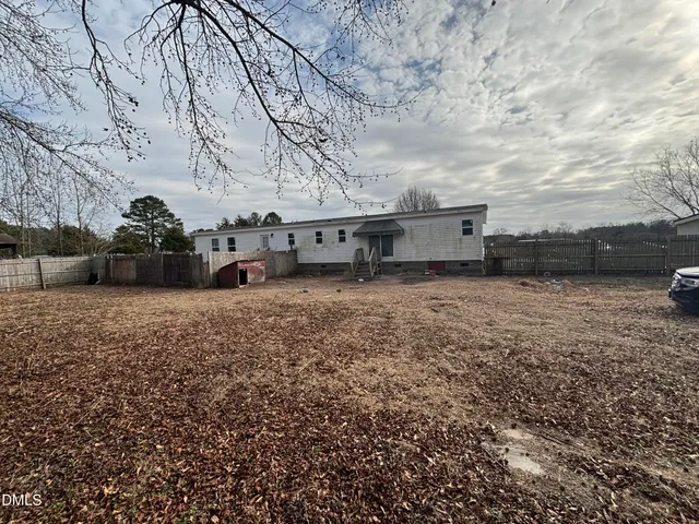 a view of a car park in front of house