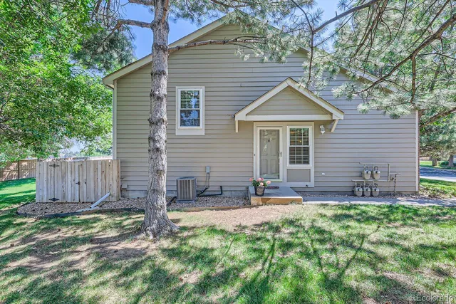 a front view of house with yard and outdoor seating