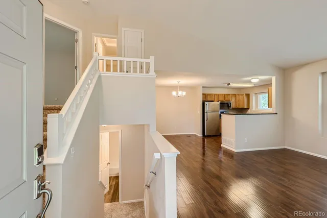 a view of a kitchen cabinets and wooden floor