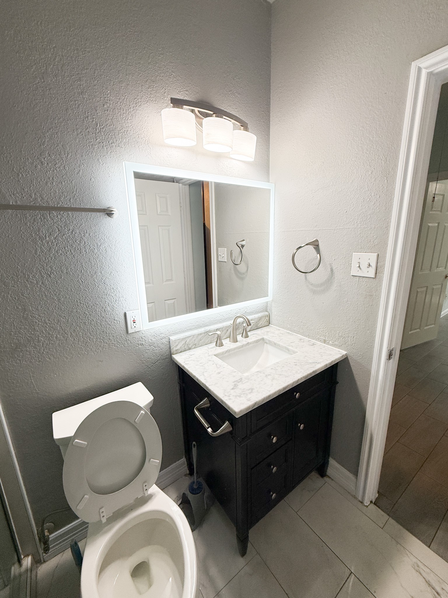 3348 Reeves Street Houston, TX 77004 - Photo 11 of 14 a bathroom with a sink toilet and mirror