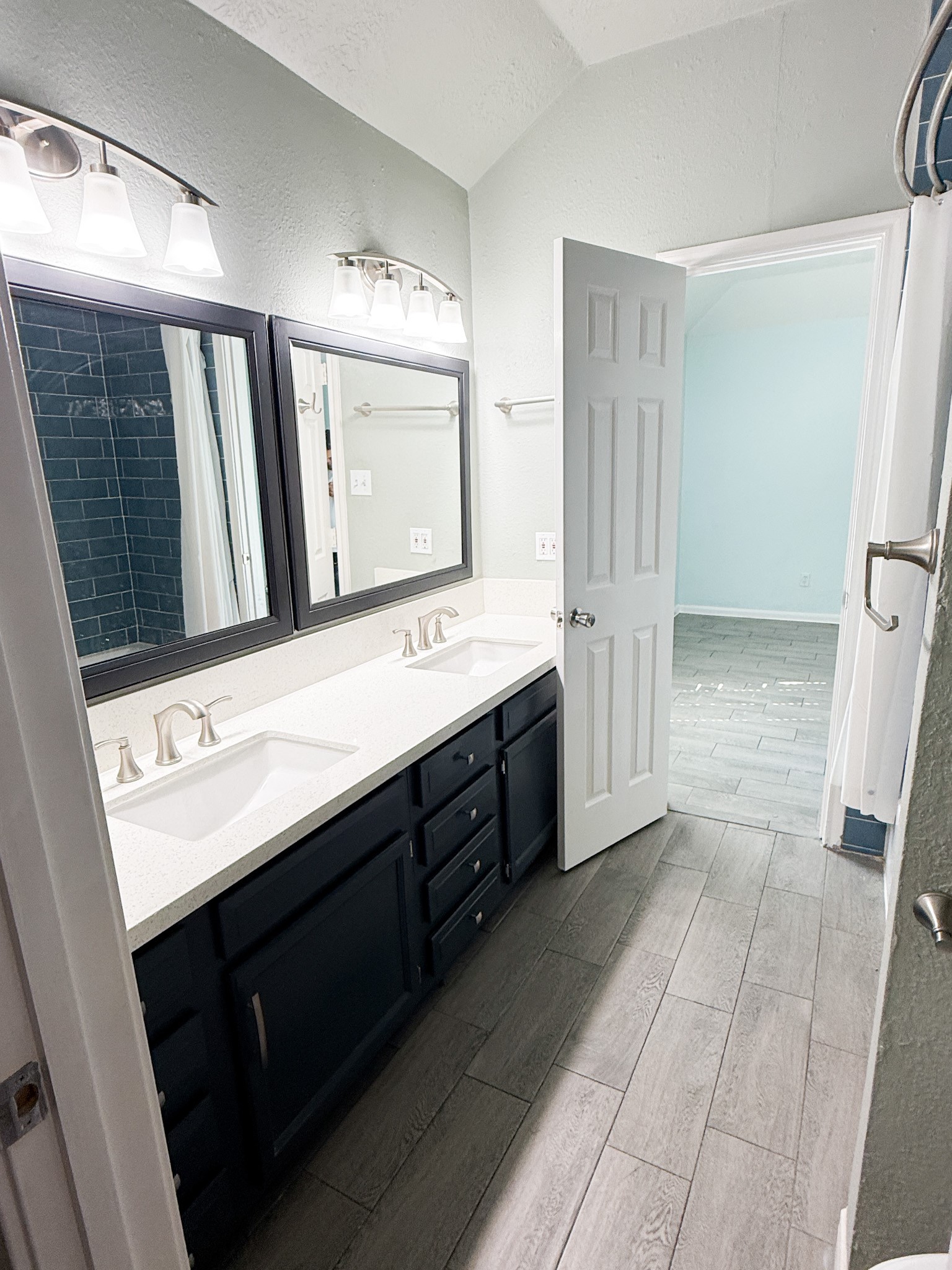 3348 Reeves Street Houston, TX 77004 - Photo 5 of 14 a bathroom with a double vanity sink a and mirror