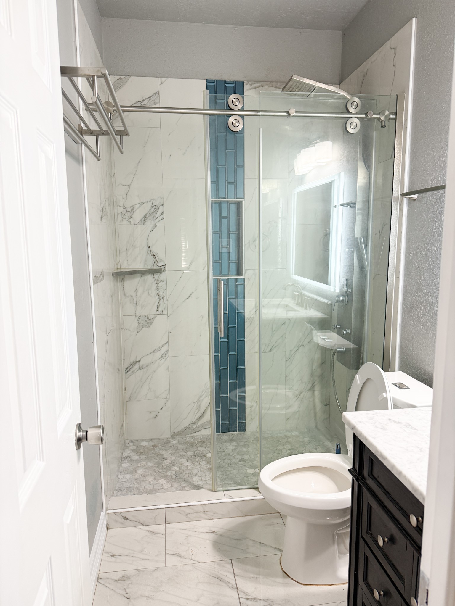 3348 Reeves Street Houston, TX 77004 - Photo 10 of 14 a bathroom with a granite countertop toilet a sink and shower