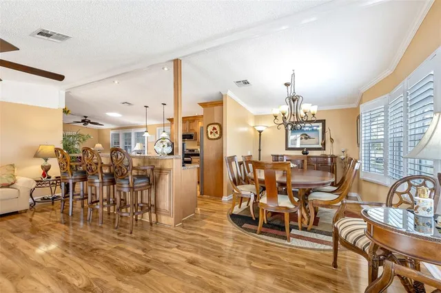 a living room with furniture wooden floor and a fireplace