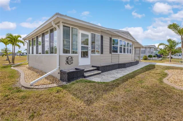 a view of a chairs and table in a patio