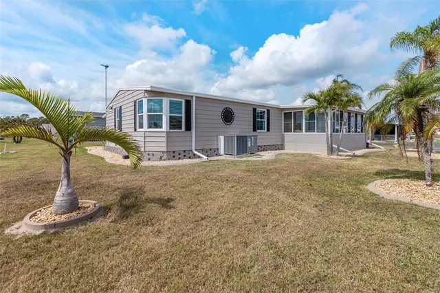 a living room with lots of furniture and a chandelier