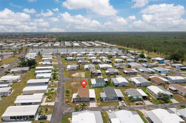 a living room with lots of furniture and a large window
