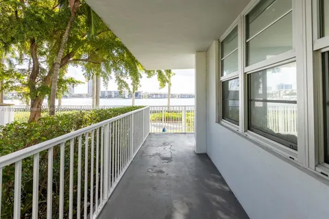 a view of a balcony with trees