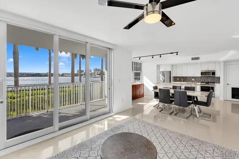 a living room with lots of furniture and a chandelier