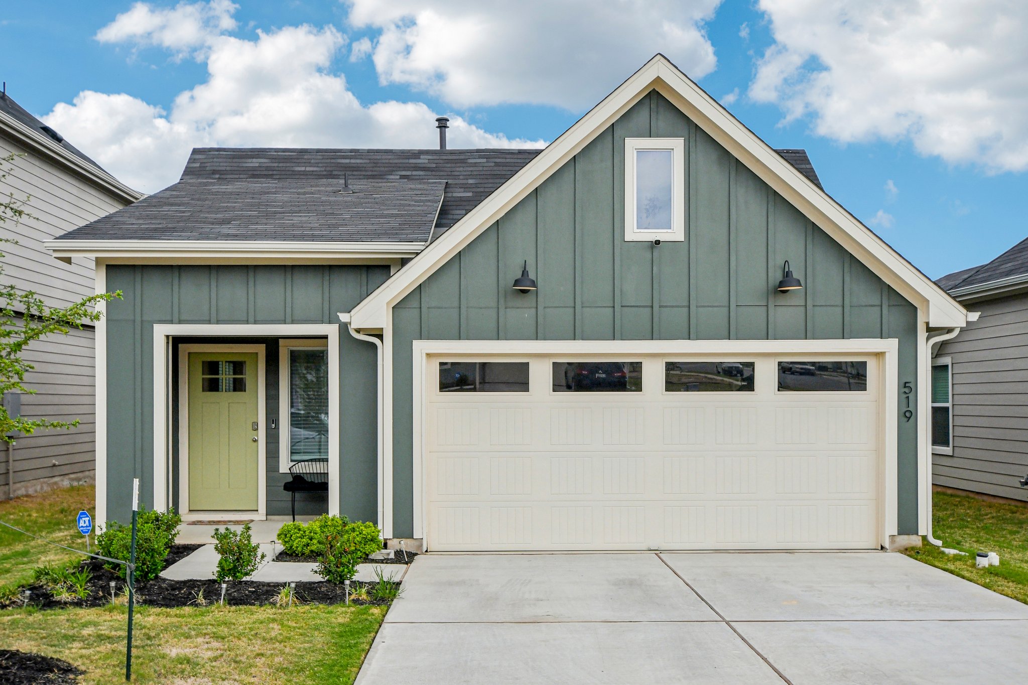 519 Sandringham Loop Kyle, TX 78640 - Photo 1 of 32 View of front of property with board and batten siding, a shingled roof, a garage, and concrete driveway