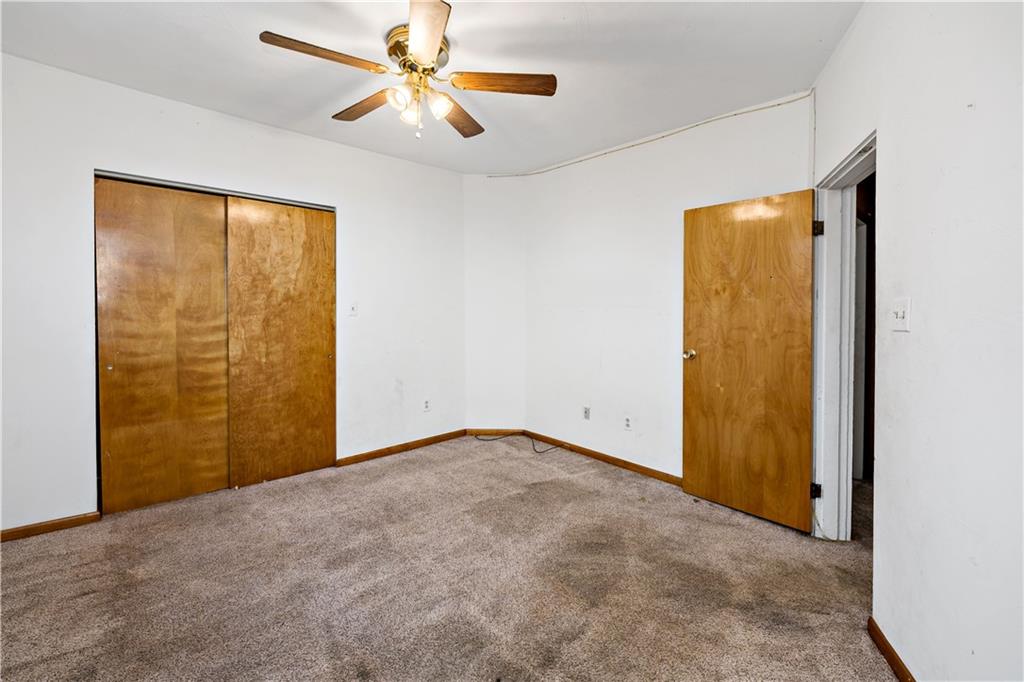 545 Stokes Avenue Braddock, PA 15104 - Photo 16 of 34 an empty room with windows and fan