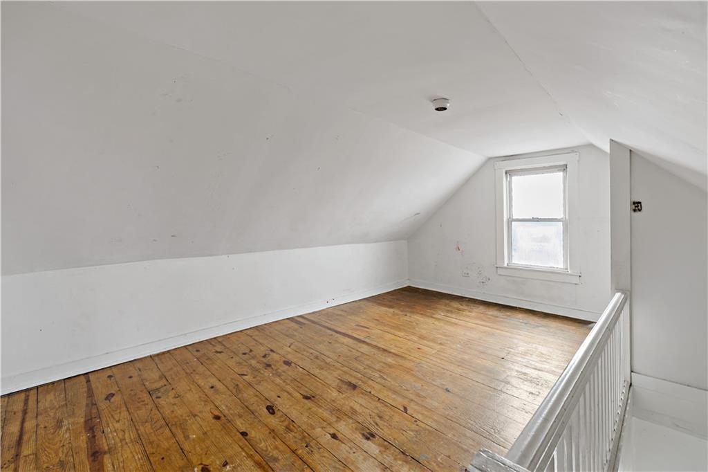 545 Stokes Avenue Braddock, PA 15104 - Photo 22 of 34 wooden floor in an empty room with a window
