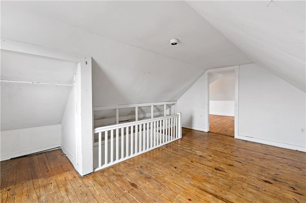 545 Stokes Avenue Braddock, PA 15104 - Photo 23 of 34 a view of a hallway with wooden floor