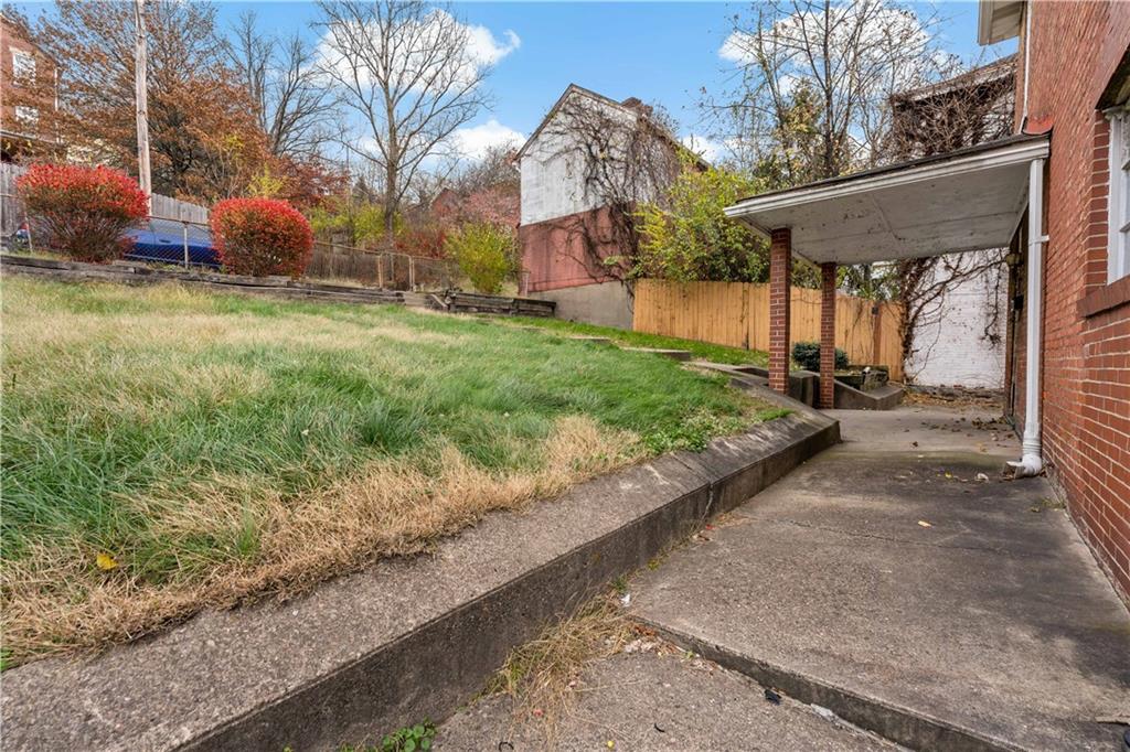 545 Stokes Avenue Braddock, PA 15104 - Photo 26 of 34 a view of a house with a yard and pathway