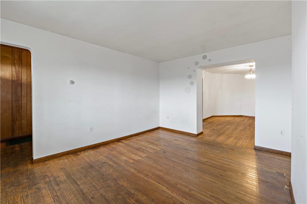 545 Stokes Avenue Braddock, PA 15104 - Photo 6 of 34 a view of an empty room with wooden floor