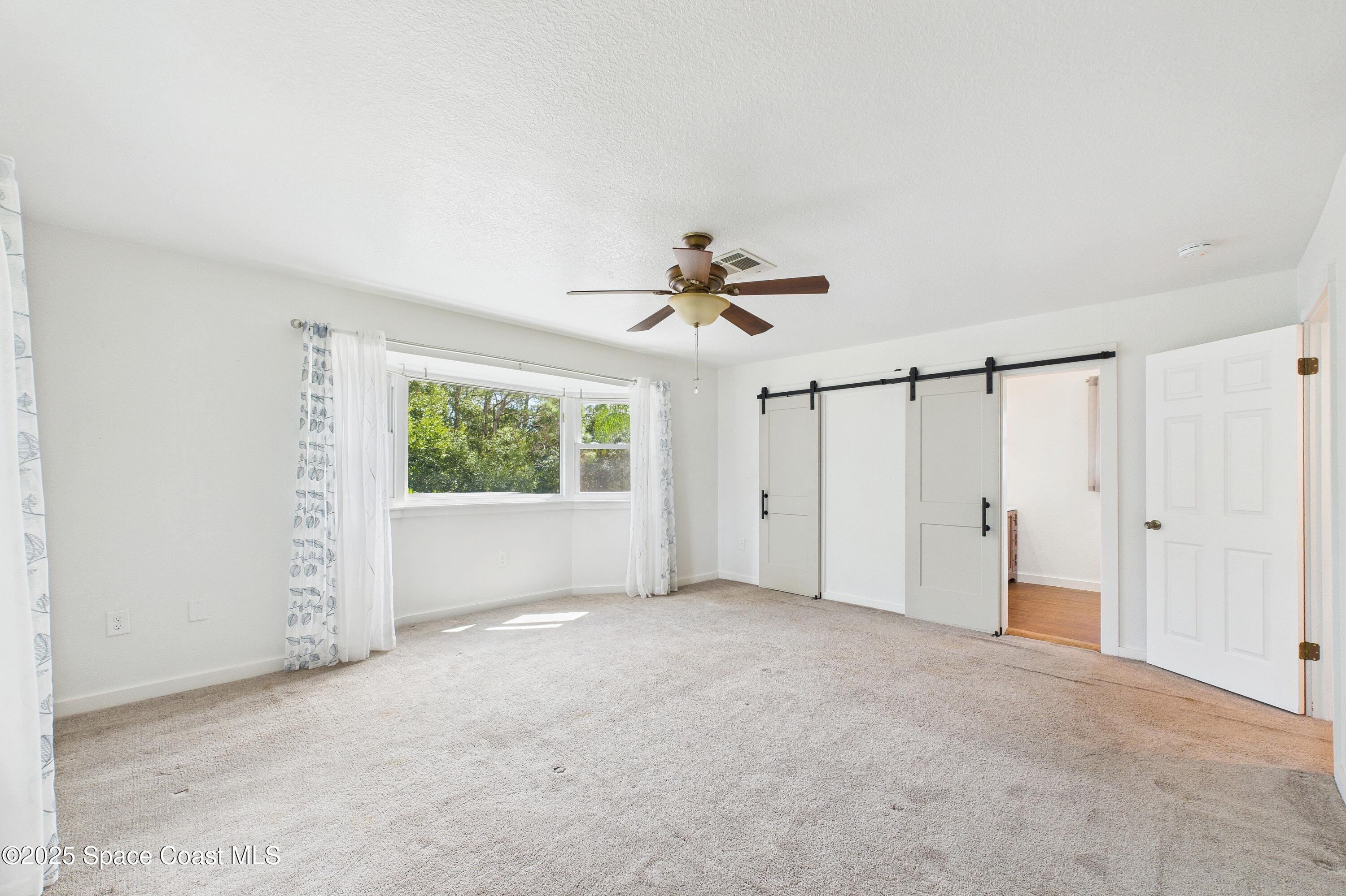 3435 Huggins Drive Malabar, FL 32950 - Photo 36 of 63 2nd Floor Primary Bedroom