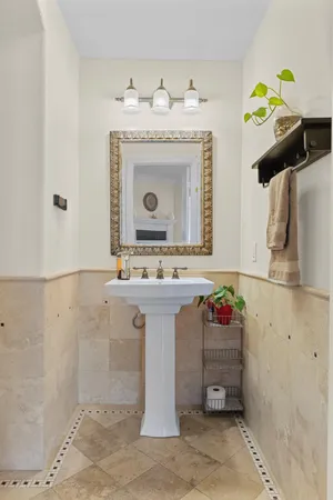 a bathroom with a sink vanity and a mirror