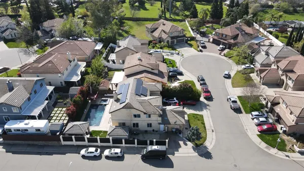 an aerial view of houses with outdoor space