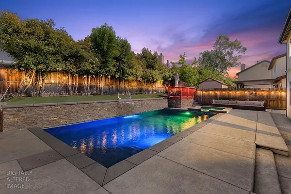 a view of swimming pool with a patio