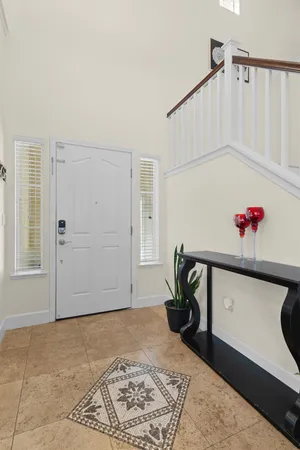 a hallway with a white stove top oven and cabinets