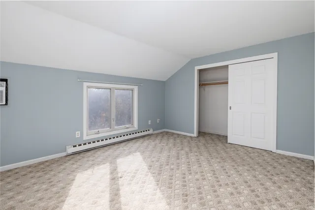 an empty room with a empty space and window