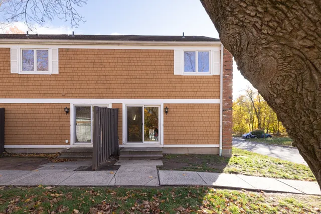 a view of a house with a door and a chair