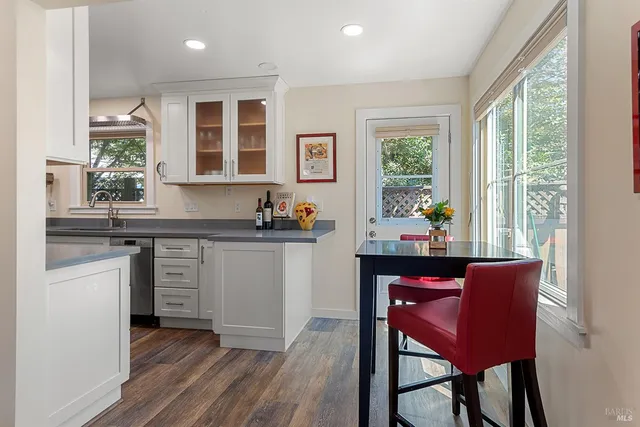 a kitchen with a sink cabinets and window
