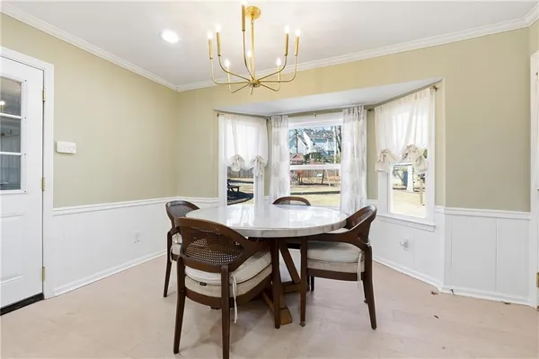 a bathroom with a sink a toilet and a window