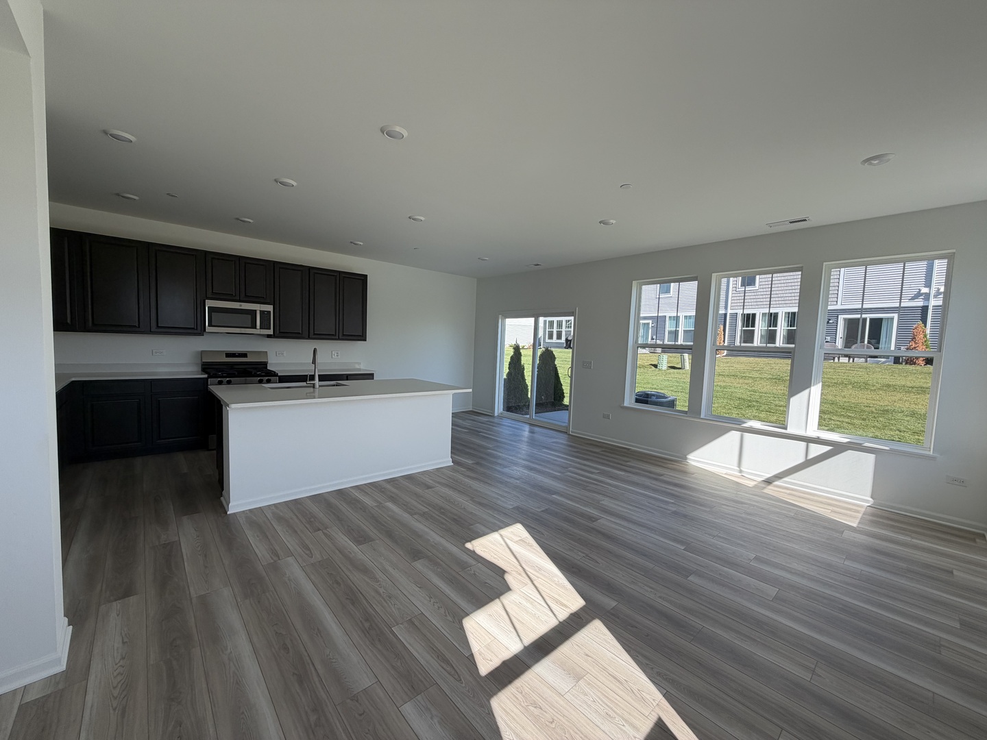 12058 Jordi Road Huntley, IL 60142 - Photo 2 of 13 a living room with furniture and a wooden floor