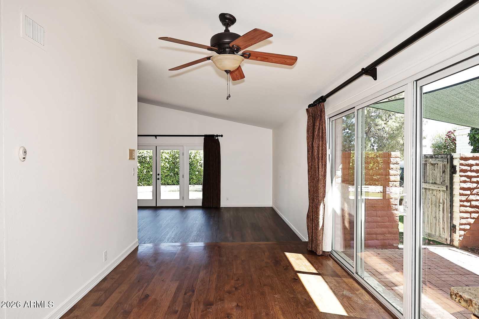 5426 South Lighthouse Lane Tempe, AZ 85283 - Photo 11 of 60 a view of empty room with wooden floor and fan