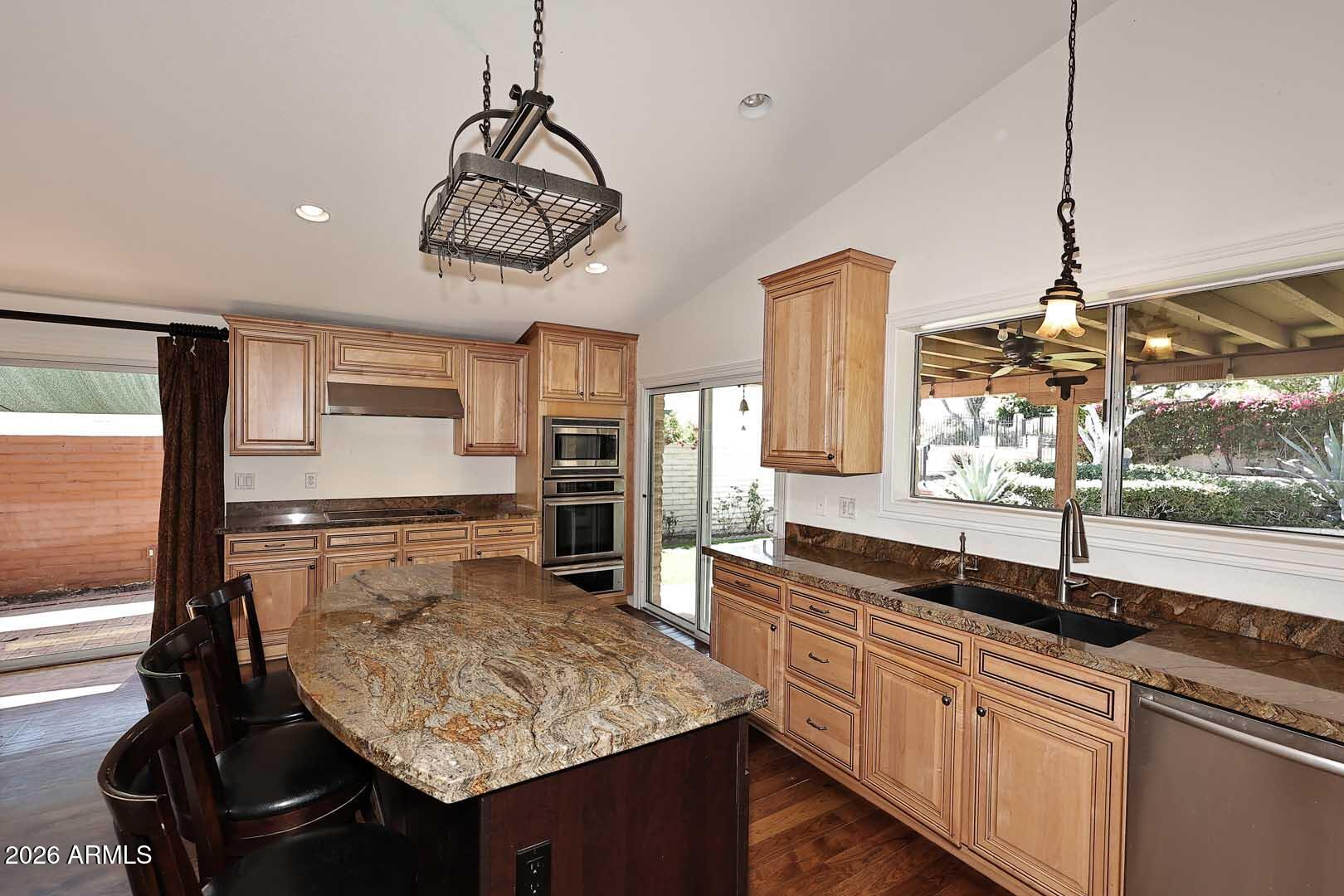 5426 South Lighthouse Lane Tempe, AZ 85283 - Photo 14 of 60 a kitchen with a counter space a sink and cabinets