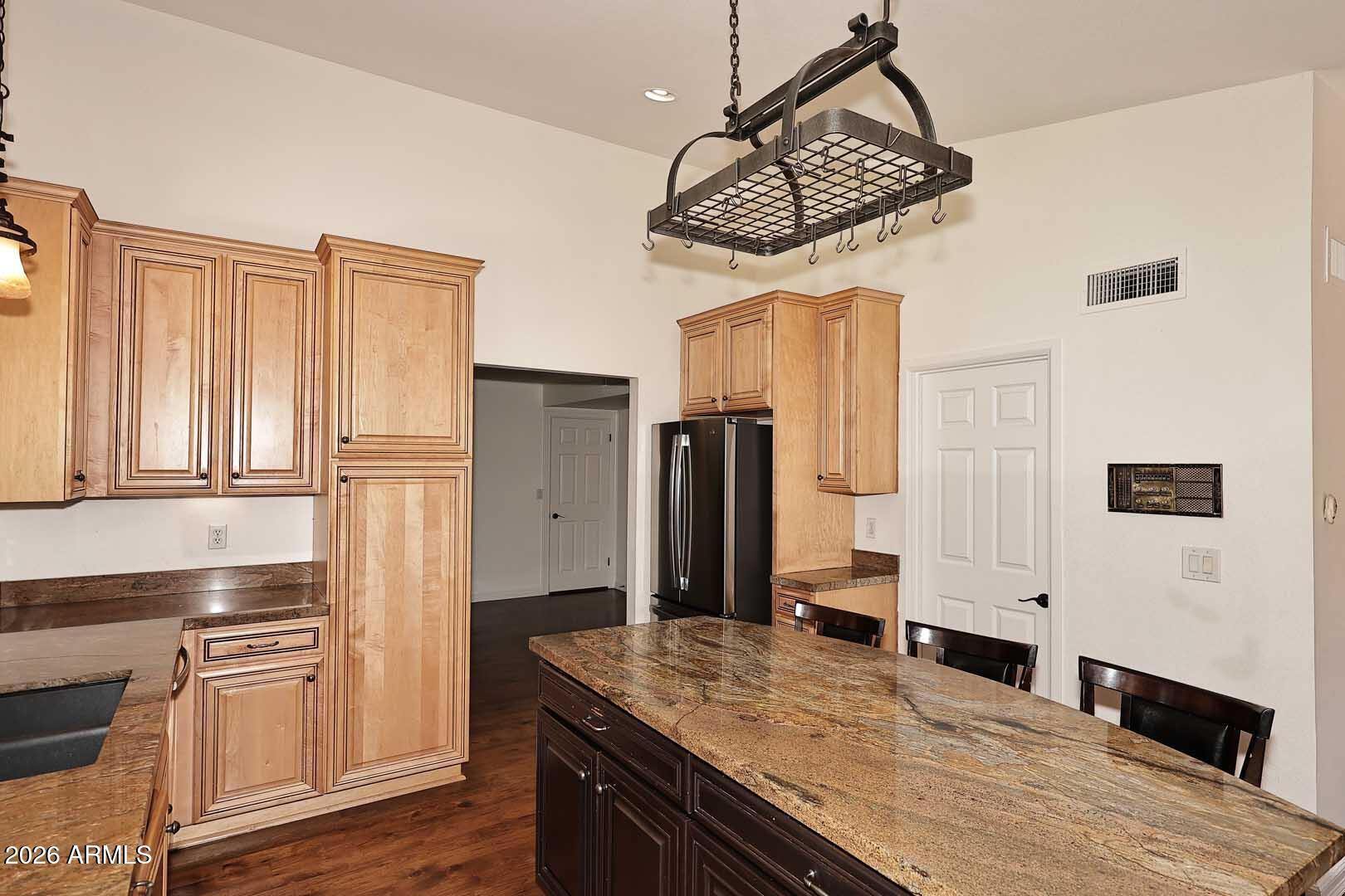 5426 South Lighthouse Lane Tempe, AZ 85283 - Photo 16 of 60 a kitchen with stainless steel appliances granite countertop a stove and a refrigerator
