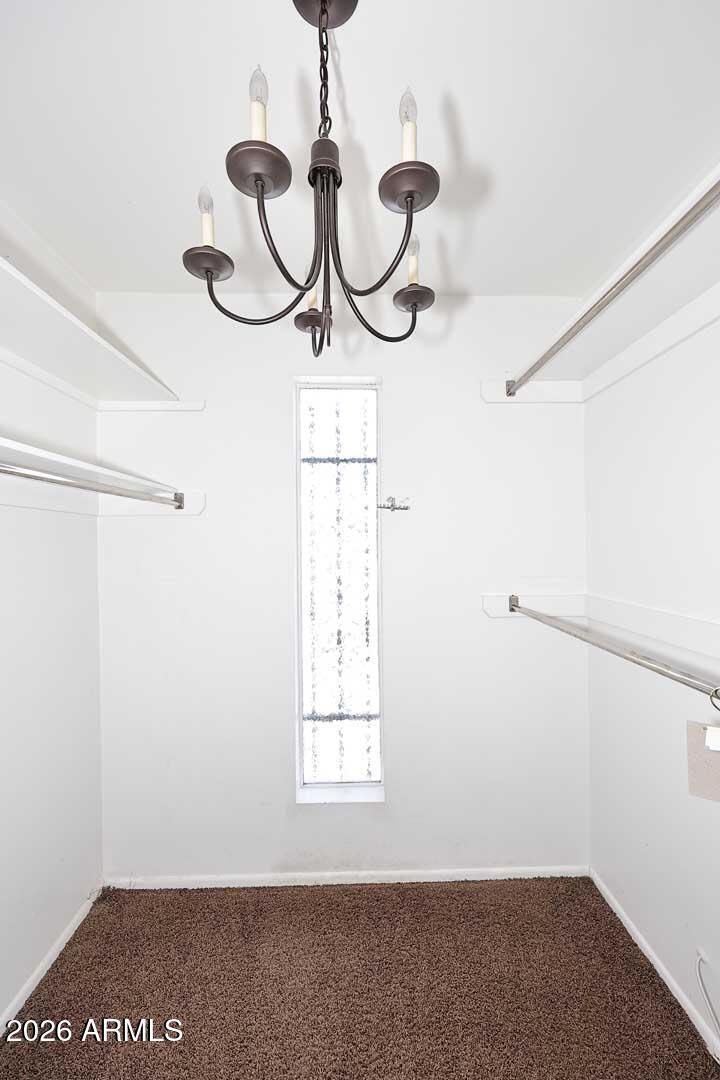 5426 South Lighthouse Lane Tempe, AZ 85283 - Photo 28 of 60 a view of a room with rack on the wall and window