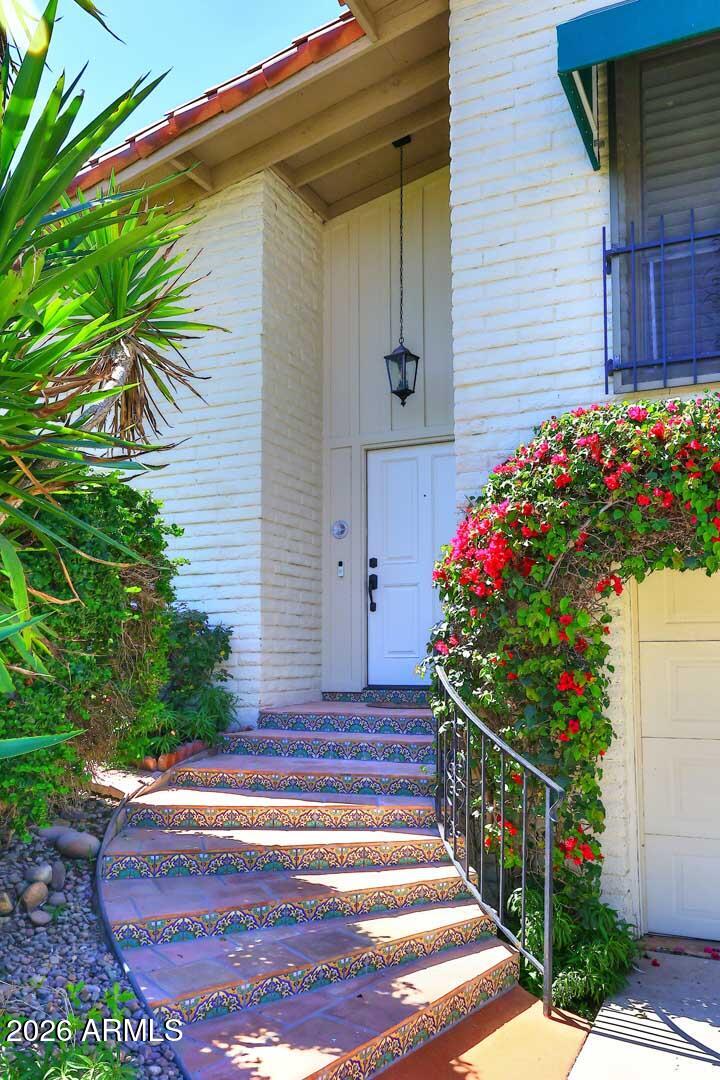 5426 South Lighthouse Lane Tempe, AZ 85283 - Photo 3 of 60 a flower garden is sitting in front of a house