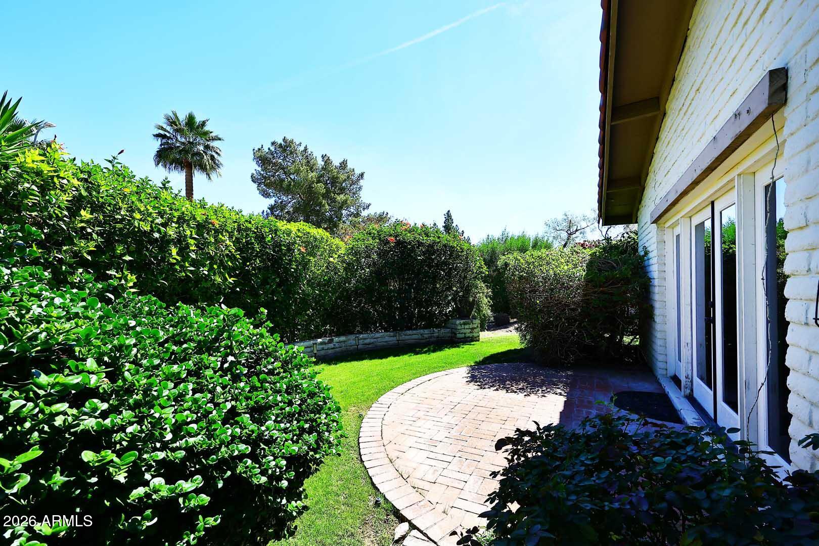 5426 South Lighthouse Lane Tempe, AZ 85283 - Photo 4 of 60 a view of a garden with a fountain