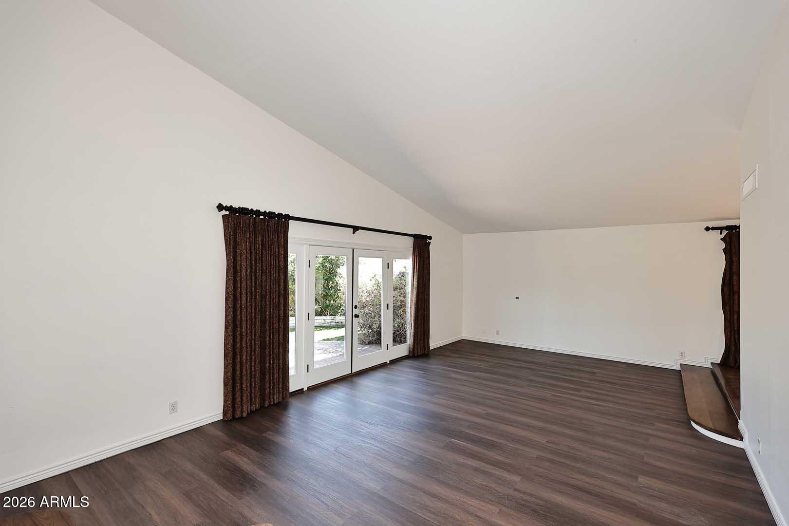 5426 South Lighthouse Lane Tempe, AZ 85283 - Photo 7 of 60 an empty room with wooden floor and windows