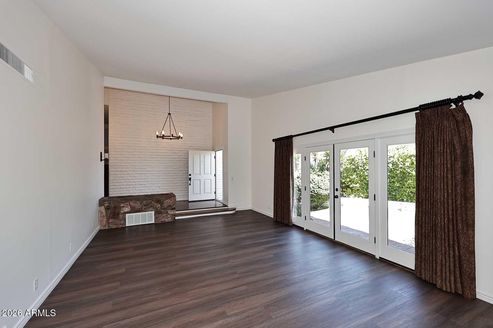 5426 South Lighthouse Lane Tempe, AZ 85283 - Photo 8 of 60 wooden floor in an empty room with a window