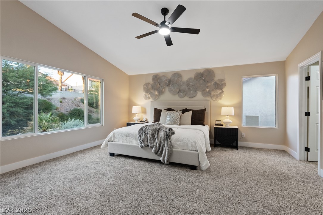 1662 Ravanusa Drive Henderson, NV 89052 - Photo 43 of 74 A restful bedroom offers large picture windows overlooking natural landscaping.