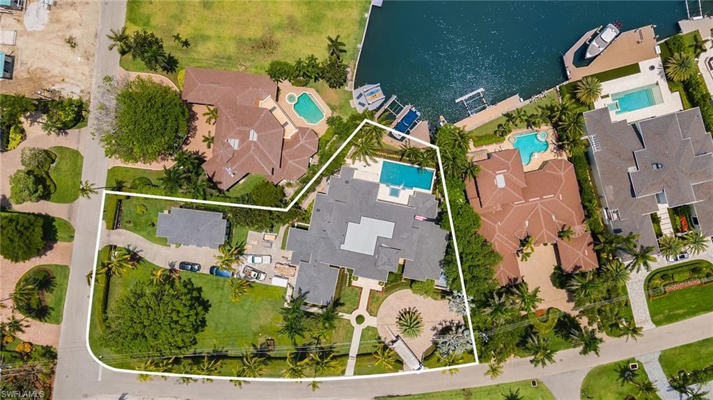 275 Springline Drive Naples, FL 34102 - Photo 49 of 50 Aerial view of property's location featuring a pool and property boundaries highlighted