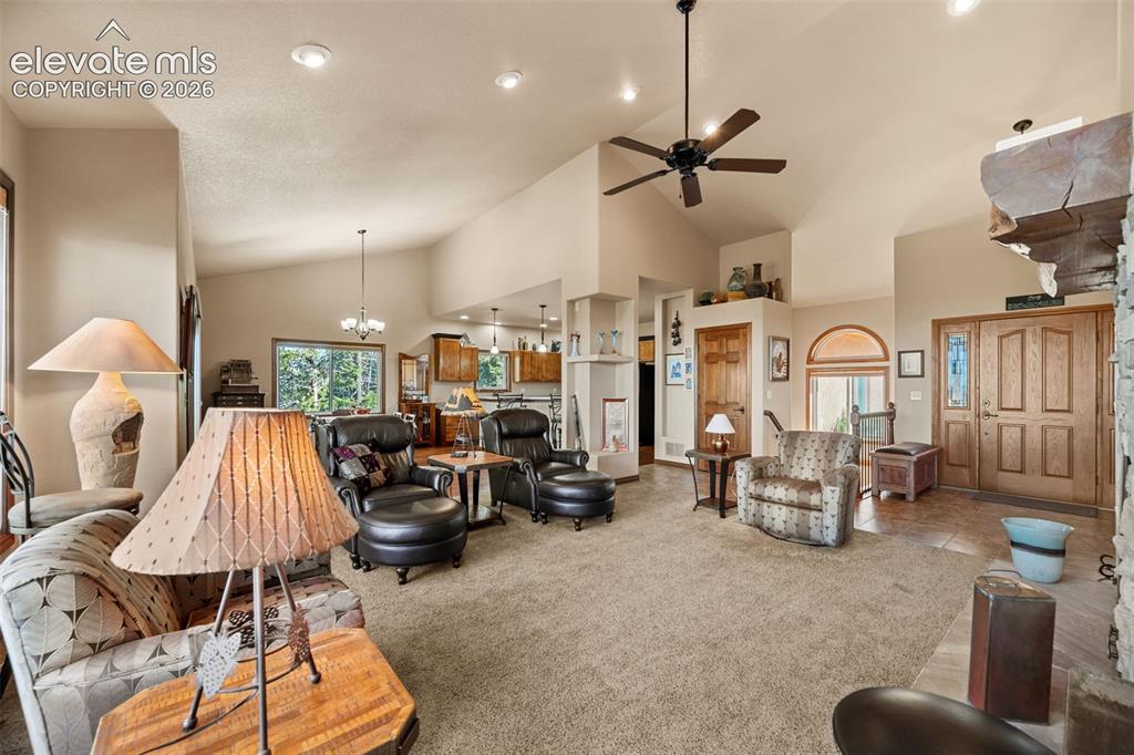131 Paradiso Road Divide, CO 80814 - Photo 14 of 50 a bedroom with furniture and a chandelier