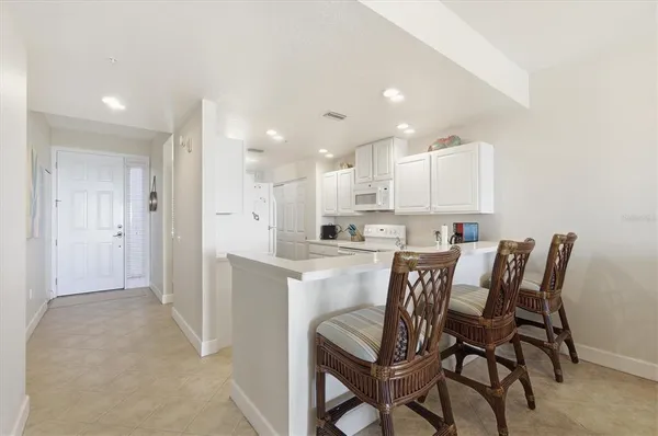 a view of kitchen with table and chairs